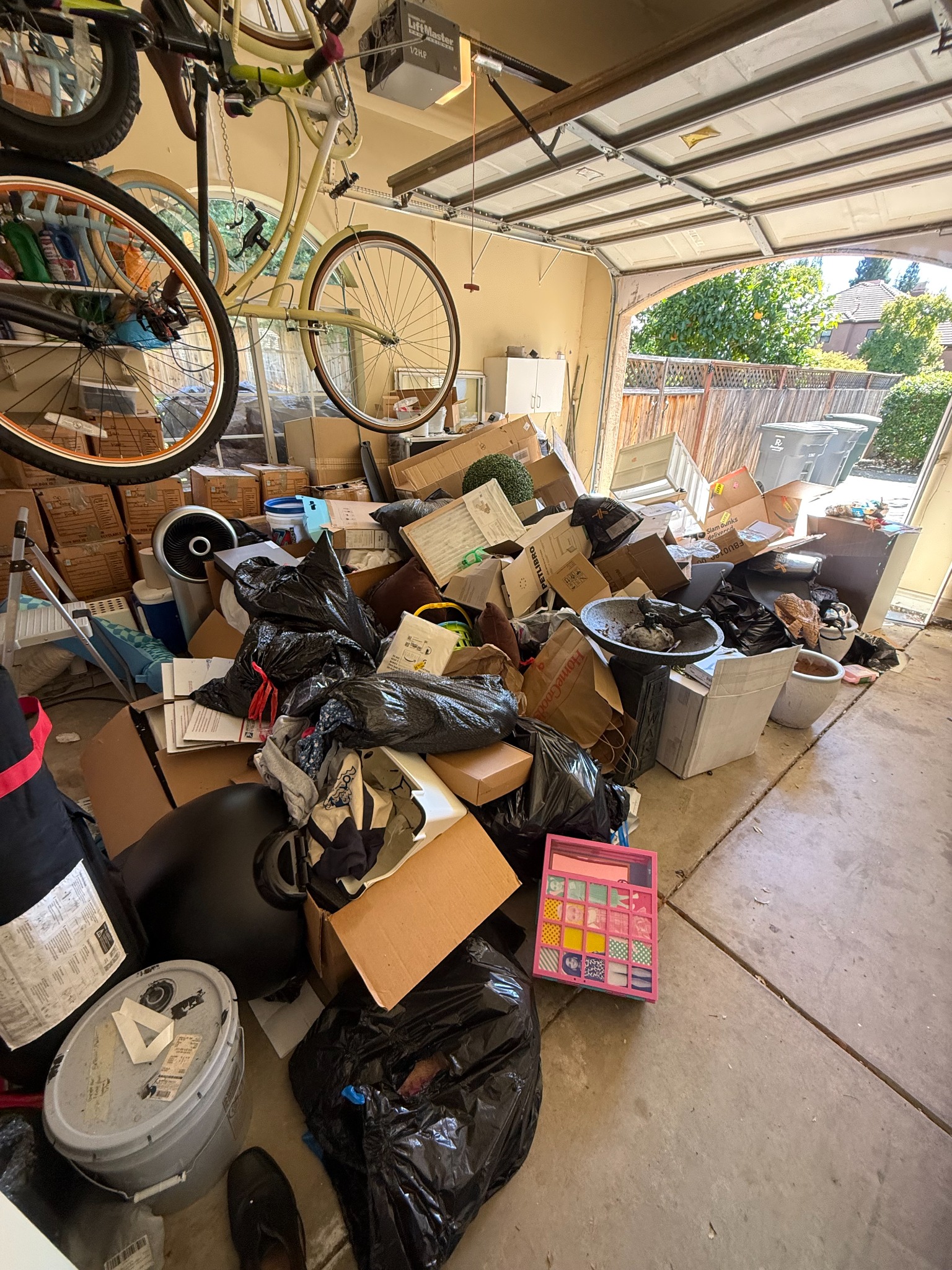 Before garage cleanout in Granite Bay with boxes and household junk