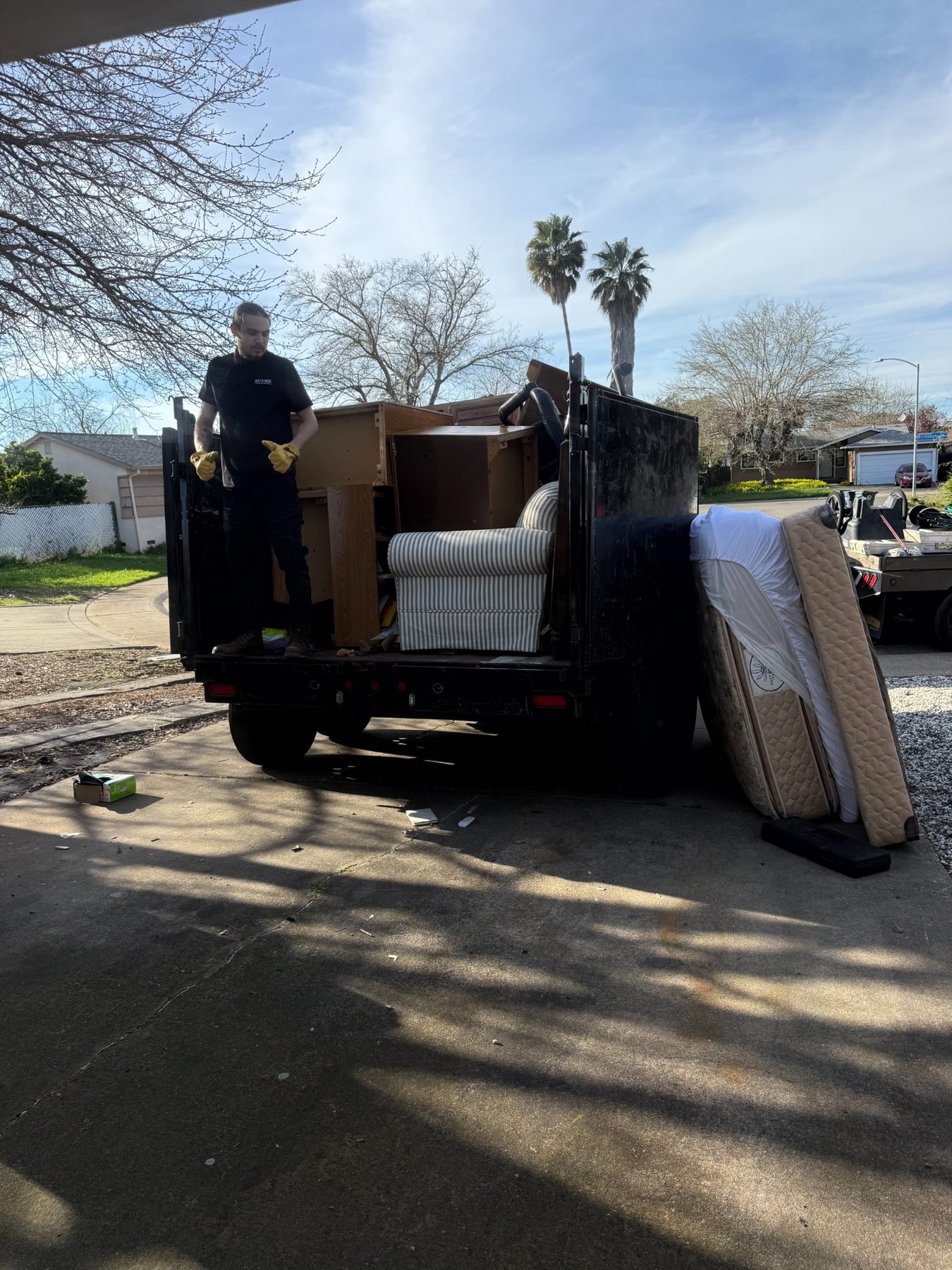 Way 2 Haul crew loading a trailer during a Sacramento junk removal job